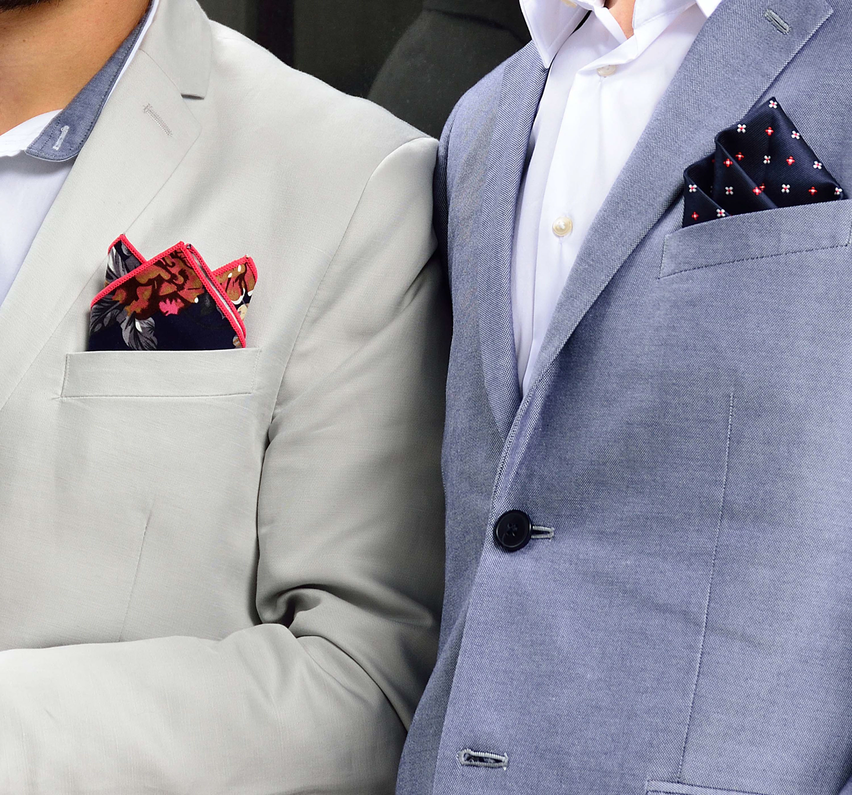 Monumental building with two men in front and gorgeous pocket squares by di Venisco.