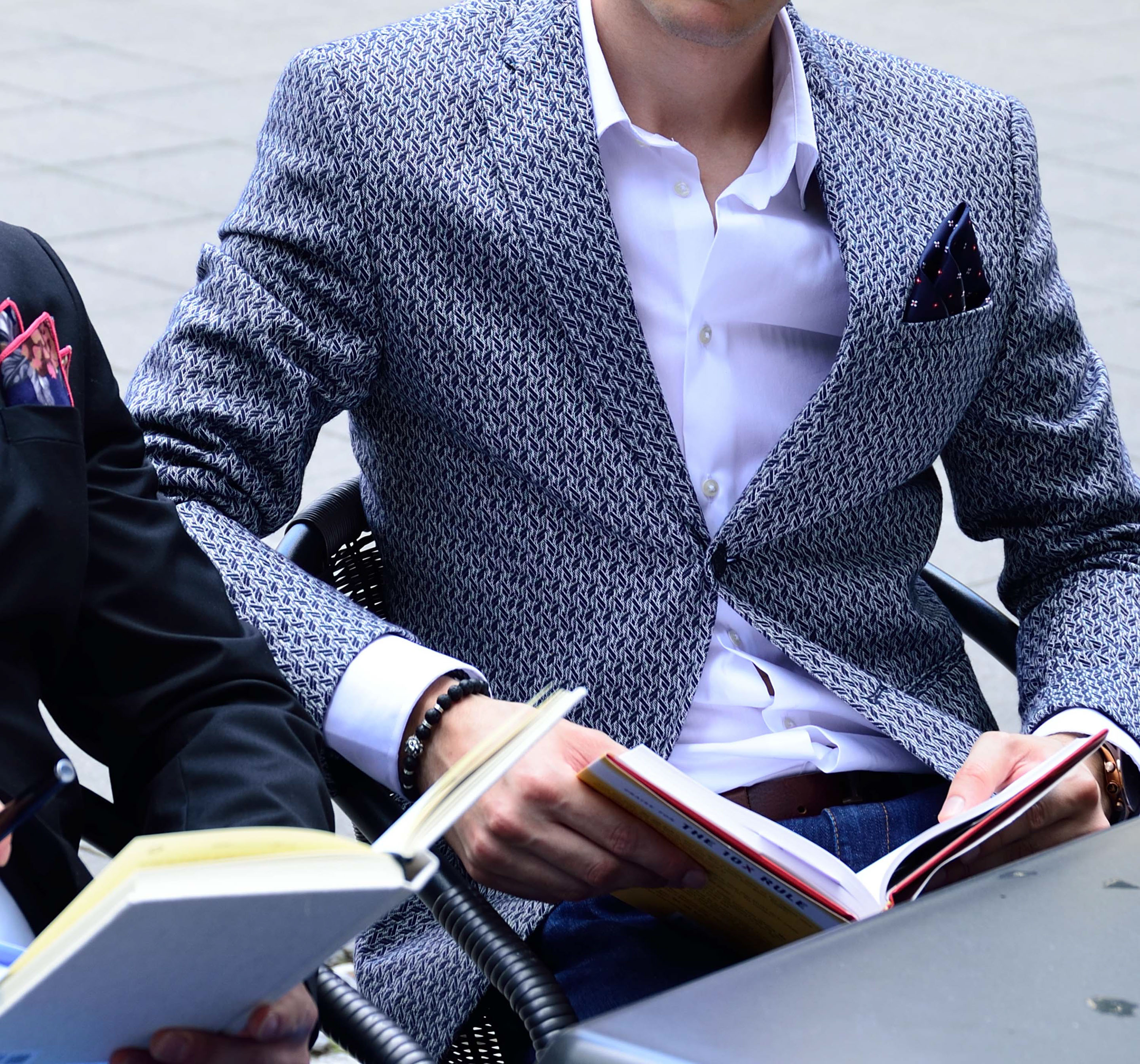 Monumental building with two men in front and gorgeous pocket squares by di Venisco.