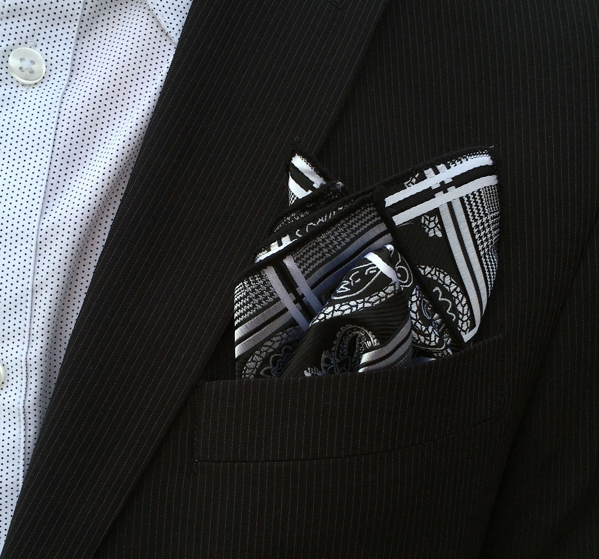 Two gentlemen together with a pretty women showing their classy di Venisco pocket square.