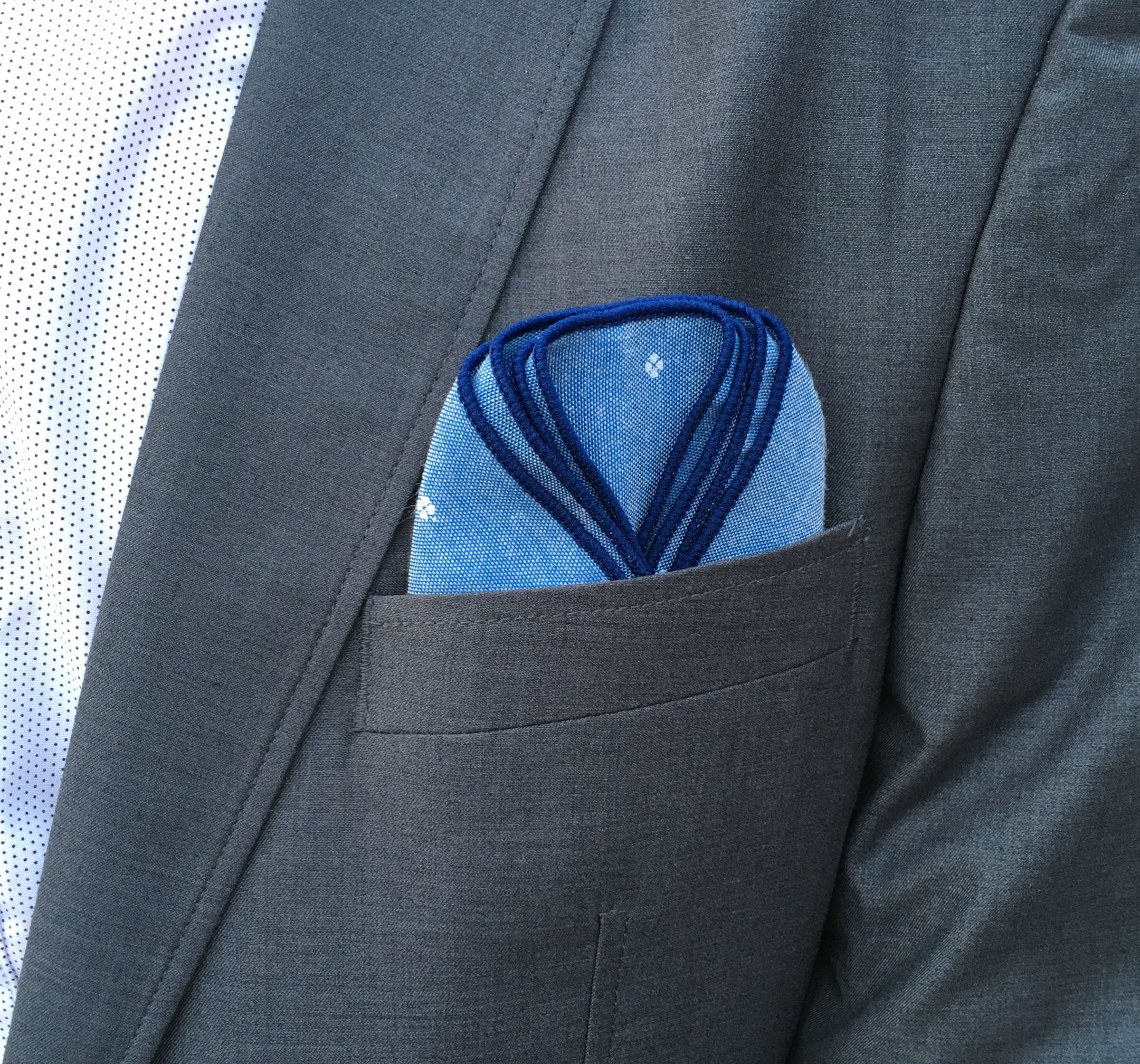 Two gentlemen together with a pretty women showing their classy di Venisco pocket square.